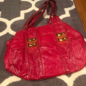 Hot pink Shih tote with gold details.